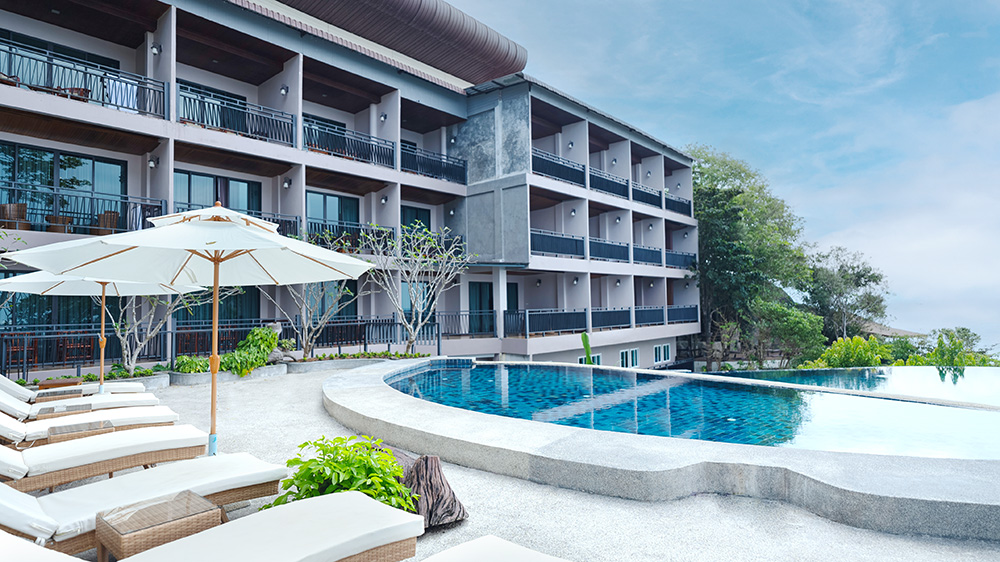Poolside hotel room with sea view